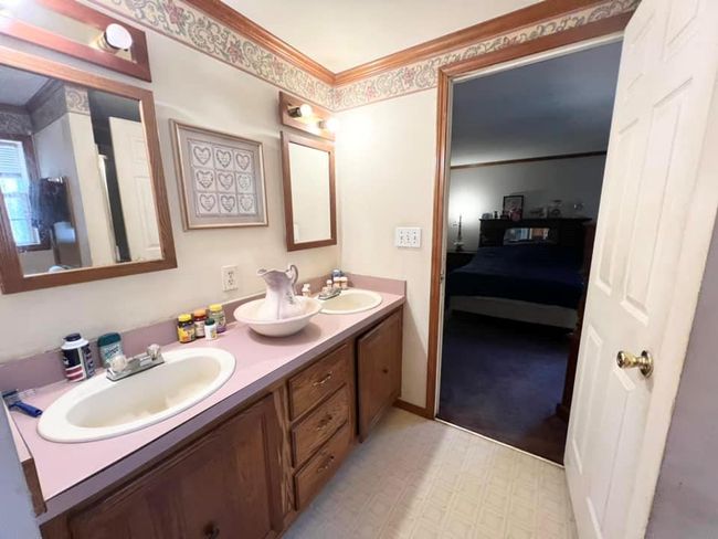 Bathroom with double sinks | Image 12