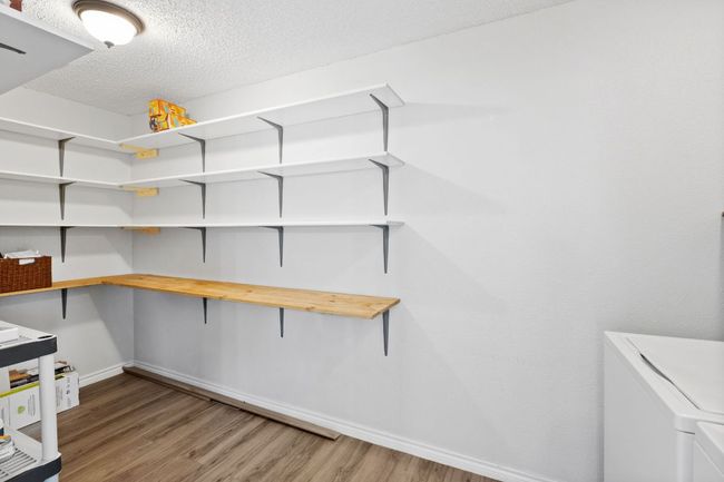 Storage room with washing machine and clothes dryer | Image 20