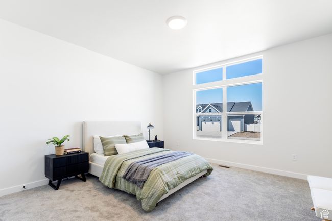 Carpeted bedroom featuring baseboards | Image 18