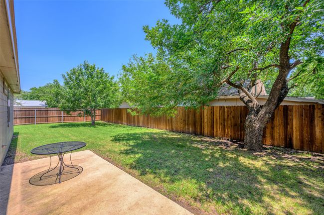 View of yard featuring an oversized patio | Image 16