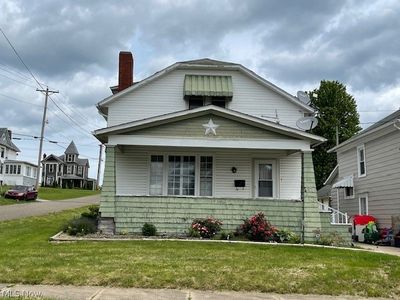 Bungalow-style home featuring a front lawn | Image 1