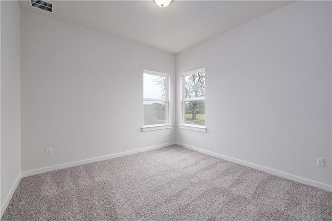 Carpeted empty room featuring baseboards | Image 17