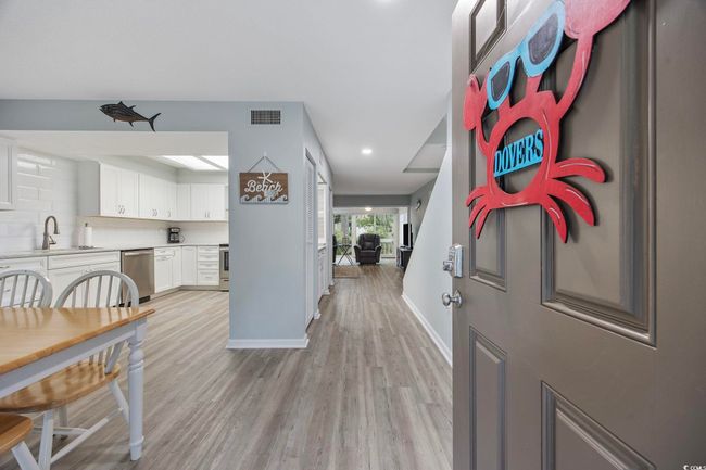 Foyer entrance featuring light wood-style floors, baseboards, and recessed lighting | Image 7