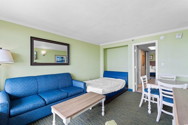 Carpeted bedroom with ornamental molding | Image 5