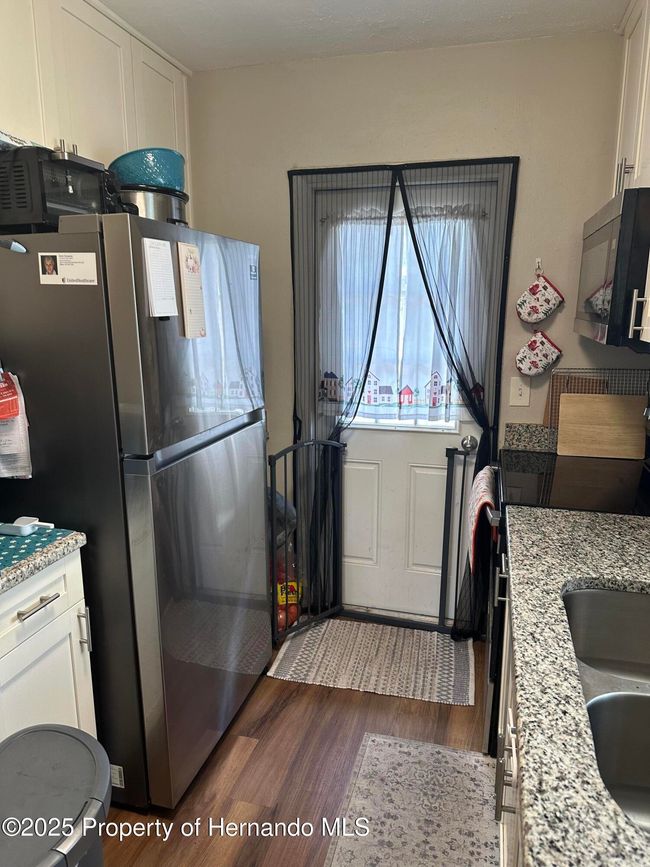 Kitchen going out to back yard. | Image 10