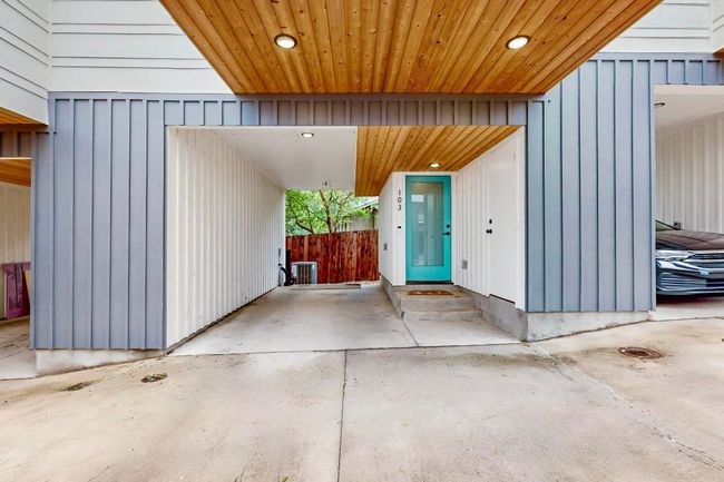 Property entrance featuring an attached carport and board and batten siding | Image 9