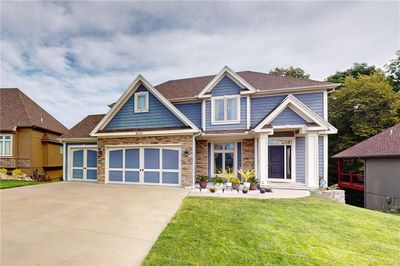 Craftsman-style house with a front lawn | Image 1