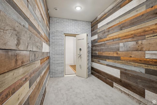 Interior space with wooden walls and light colored carpet | Image 42