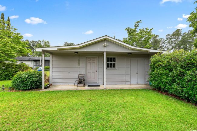 Rear view of property with a lawn | Image 34