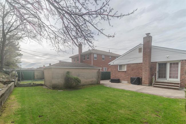 Back of house featuring a patio, entry steps, a fenced backyard, and a lawn | Image 32