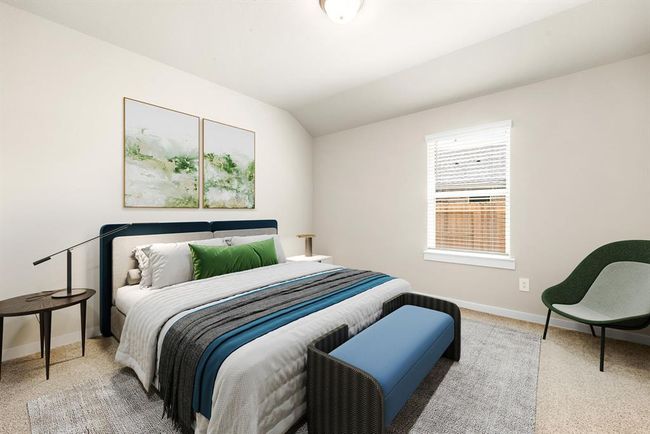 Secondary bedroom features plush carpet, neutral paint, lighting and a large window with privacy blinds. | Image 12