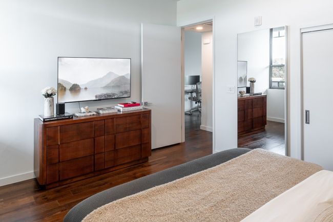 Bedroom featuring baseboards and wood finished floors | Image 14