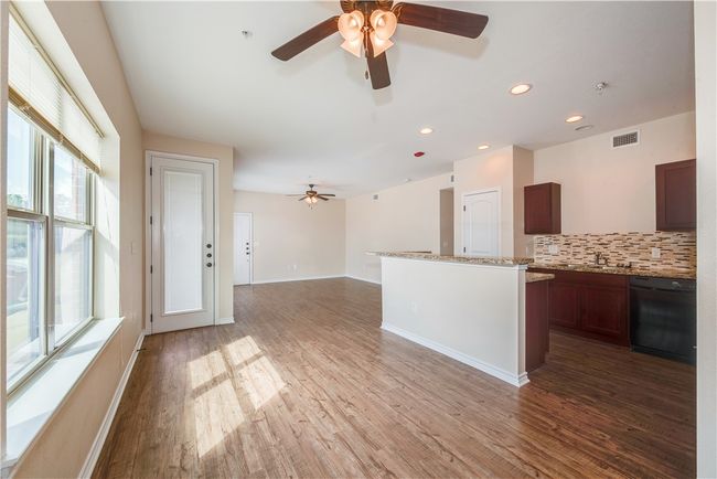 Kitchen featuring dishwasher, a wealth of natural light, ceiling fan, and decorative backsplash | Image 6