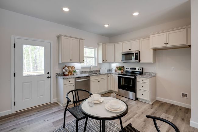 LUXE Kitchen featuring Upgraded Cabinetry + Full Granite Package | Image 10