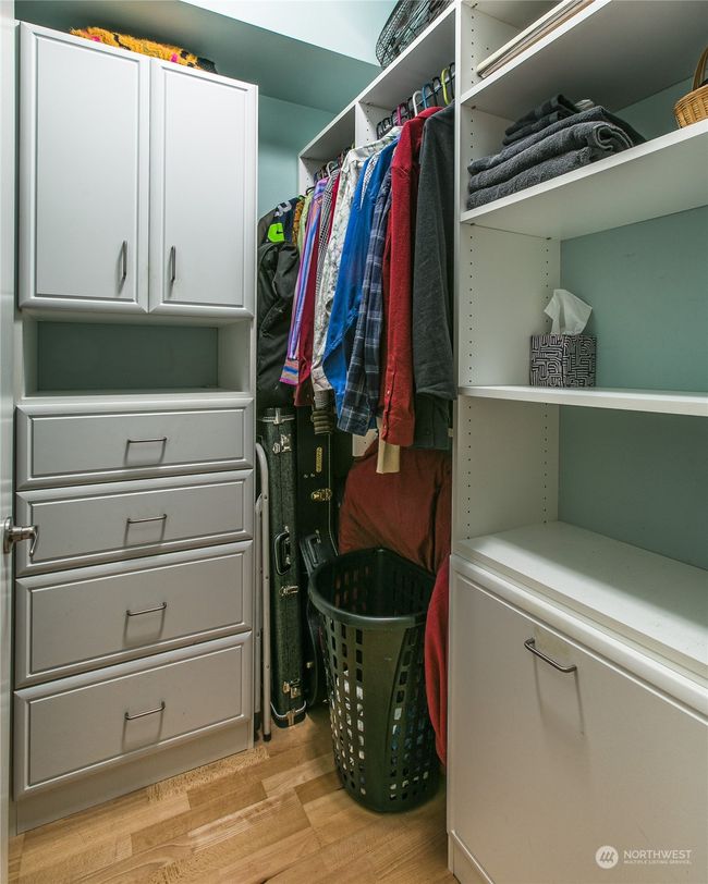 Generous walk-in closet w/ lots of built-in storage | Image 12