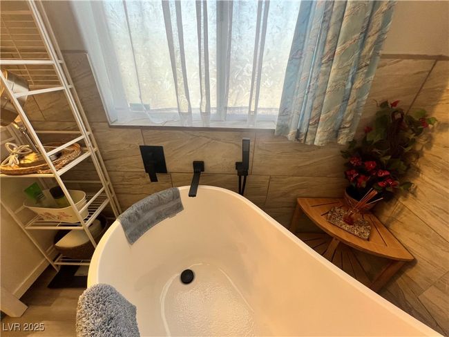 Bathroom with a soaking tub | Image 45