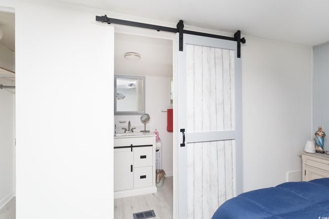 Bathroom featuring vanity and wood finished floors | Image 22