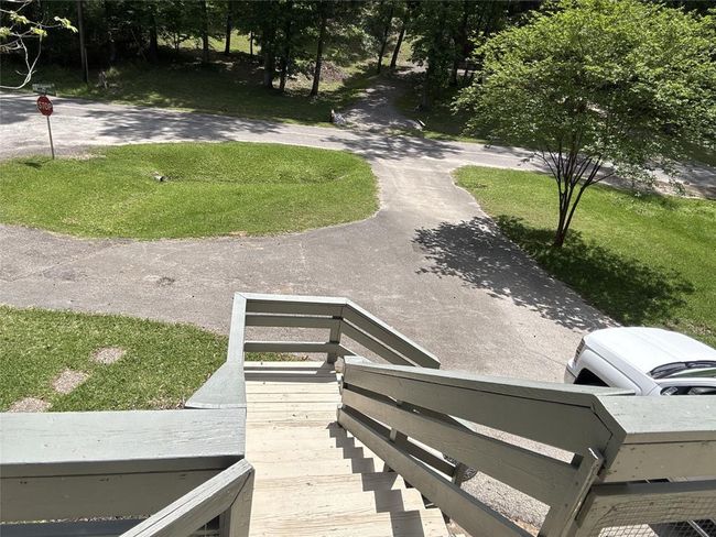 Convenient stairs from the upper deck lead directly to the garage and driveway. | Image 25