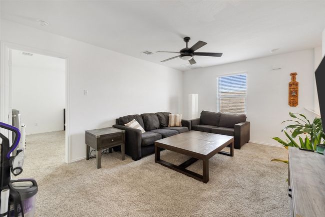 Living room featuring carpet flooring and ceiling fan | Image 20