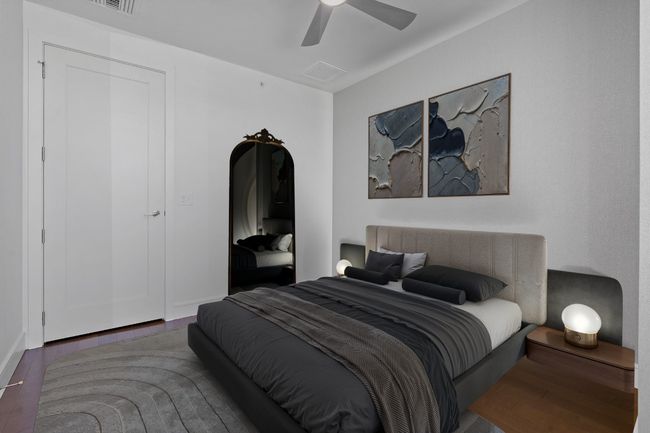 Bedroom with wood finished floors, visible vents, and a ceiling fan | Image 10