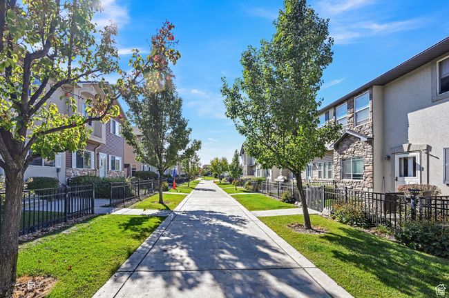 View of home's community featuring a lawn | Image 26