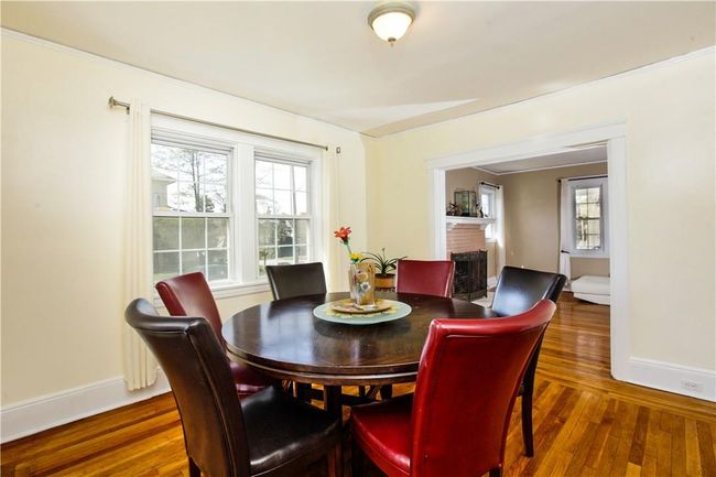 Another view of dining room with view through to living room. | Image 10