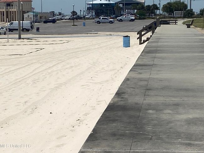beach w boardwalk at end of street | Image 8