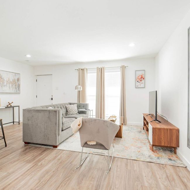 Living room featuring light wood finished floors, baseboards, and recessed lighting | Image 8