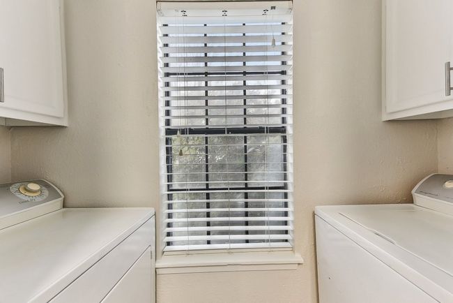 Clothes washing area with cabinet space just off the kitchen | Image 14
