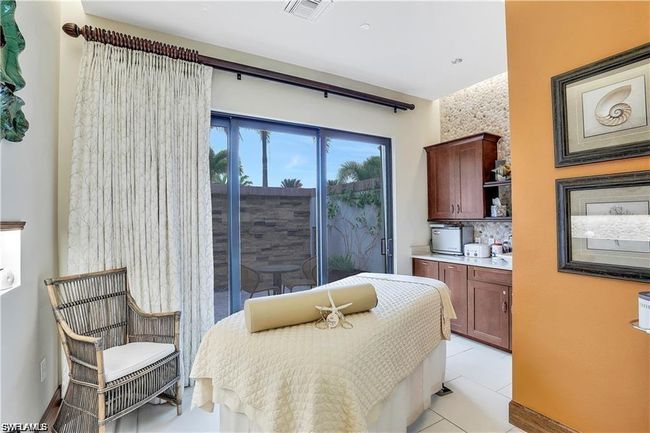 Bedroom with light tile patterned floors | Image 41