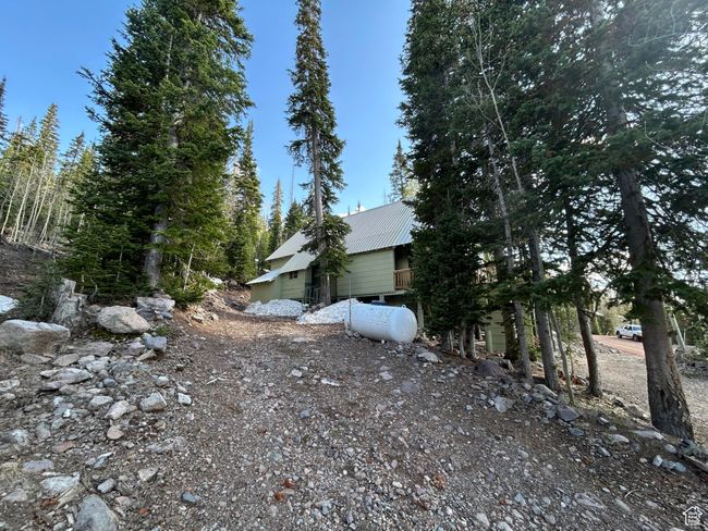 View of side of home with a metal roof | Image 7