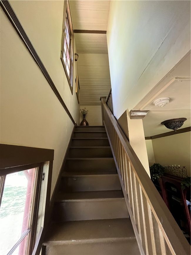 Staircase featuring a high ceiling | Image 27