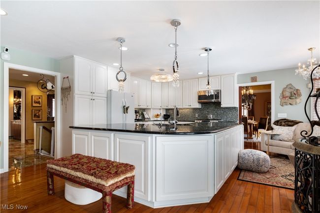 Another view of the kitchen. We want you to see this photo because it flows perfect with the Great room to the right. | Image 13