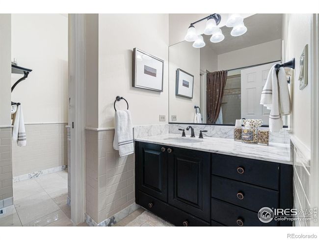 Jack and Jill Bathroom between 2nd and 3rd Bedrooms, Private Vanities with shared Bathtub and Shower. | Image 24