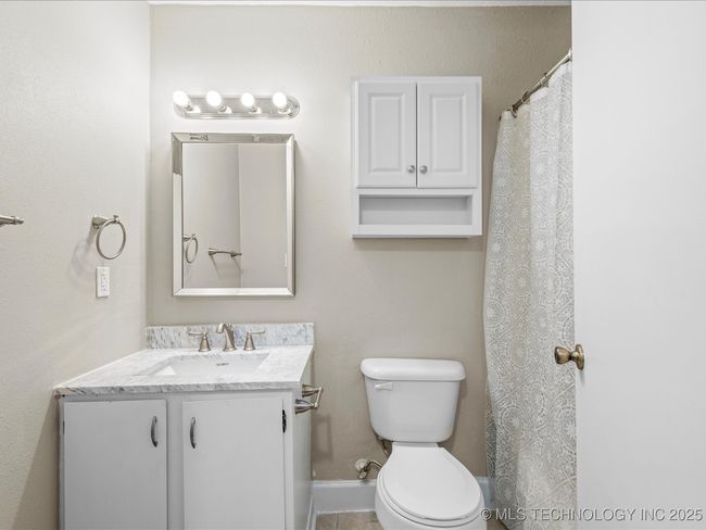Hall bathroom with tub/shower combo. New counter-top and hanging cabinet! | Image 14