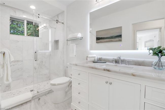 Bathroom with vanity, toilet, marble finish floor, a marble finish shower, and recessed lighting | Image 18