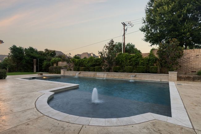 Relaxing by the pool at dusk, water feature, and many more | Image 37
