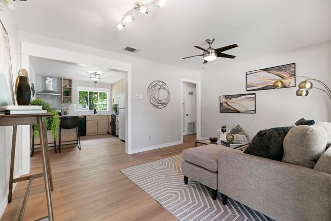 Views of the front entryway and the large window that provides a serene front yard view. | Image 5
