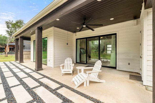 View of patio featuring a ceiling fan | Image 31