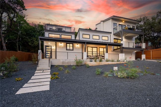 The home is set back from the street surrounded with majestic oak trees that provide incredible shade and privacy. | Image 38