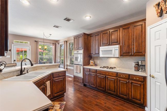 Plenty of cabinet space in the kitchen. | Image 6