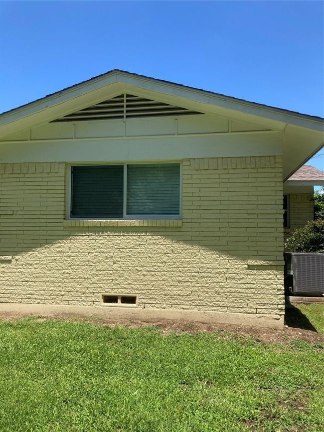 View of home's exterior featuring central AC unit outside bedroom with 1/2 bath | Image 10