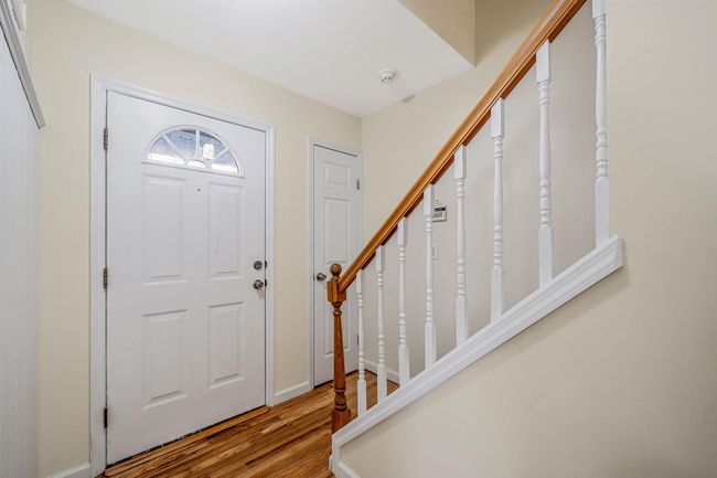 Entryway featuring stairway and wood finished floors | Image 5