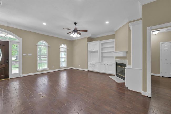 Living Room with front door on the left. | Image 11