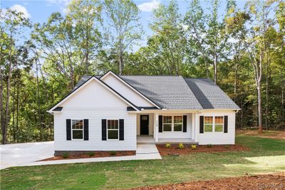 View of front of property featuring a front lawn | Image 1