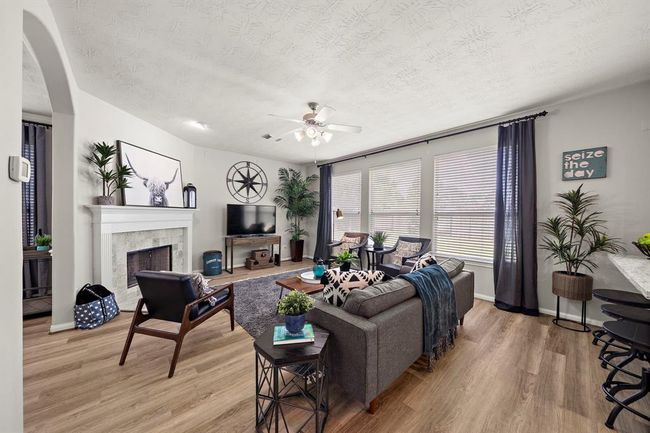 Family Room at back of home, looking out on private, fenced backyard. | Image 7