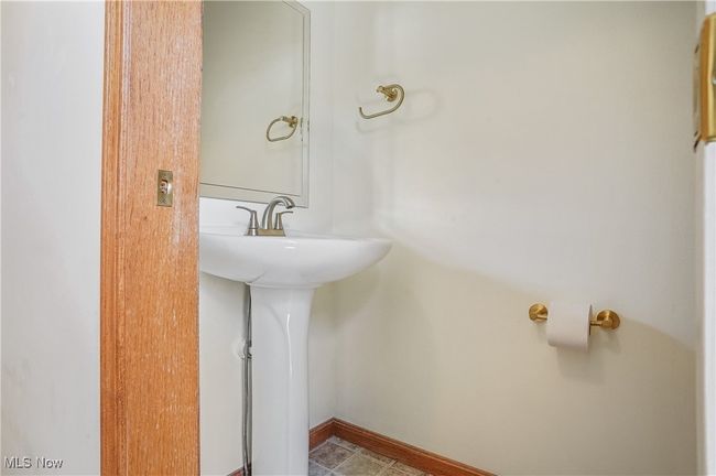 Bathroom featuring baseboards and tile patterned flooring | Image 40