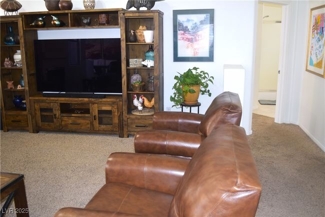 Carpeted living area with baseboards | Image 19