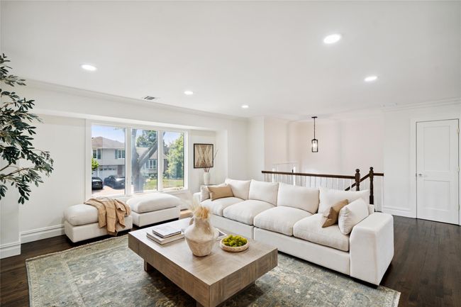 Living area with recessed lighting, dark wood-style flooring, and crown molding | Image 16