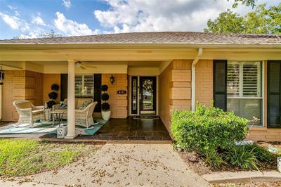 Doorway to property featuring ceiling fan and a patio area | Image 3